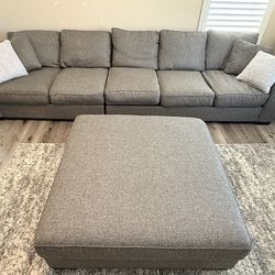Huge grey multi-tone sleeper sofa with giant ottoman and queen fold out bed
