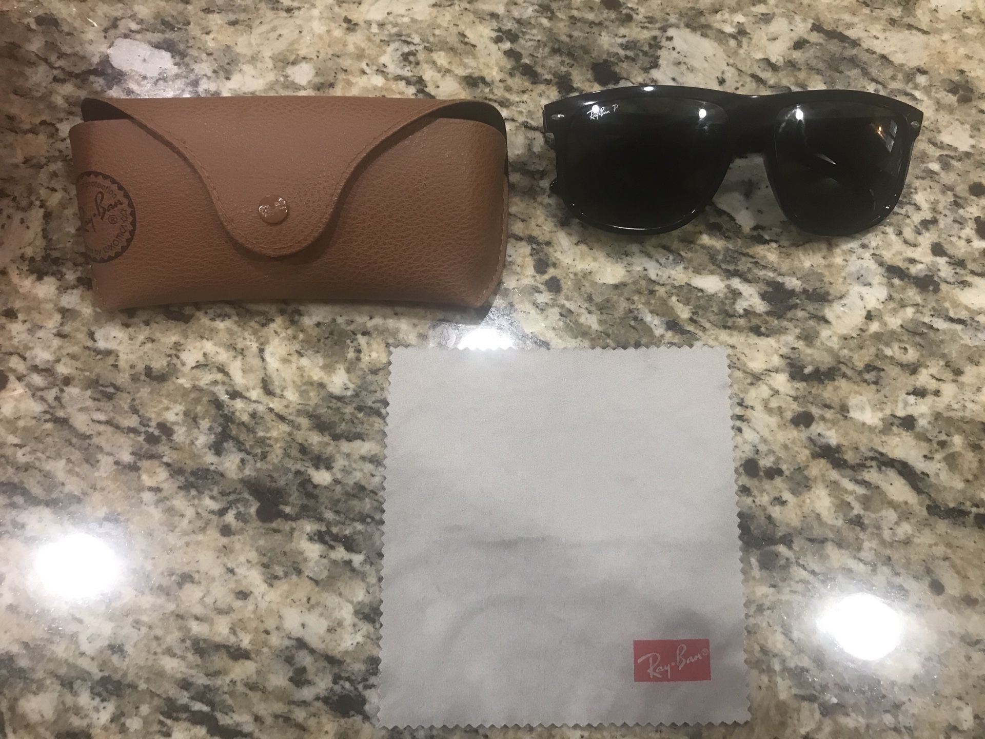 Ray Ban P Sunglasses with case and cleaning cloth.