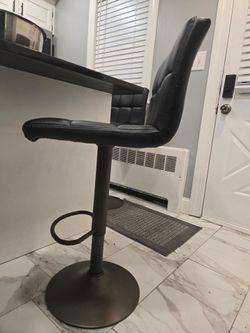 Two black high barstools in great condition.