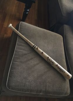 Baseball bat belt rack
