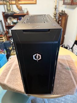 CYBERPOWERPC C SERIES | AMD RYZEN 5 1600 6-CORE PROCESSOR 8GB RAM| 1TB HDD  gaming desktop has a black CyberPowerPC case with a Gigabyte GA-AX370 moth