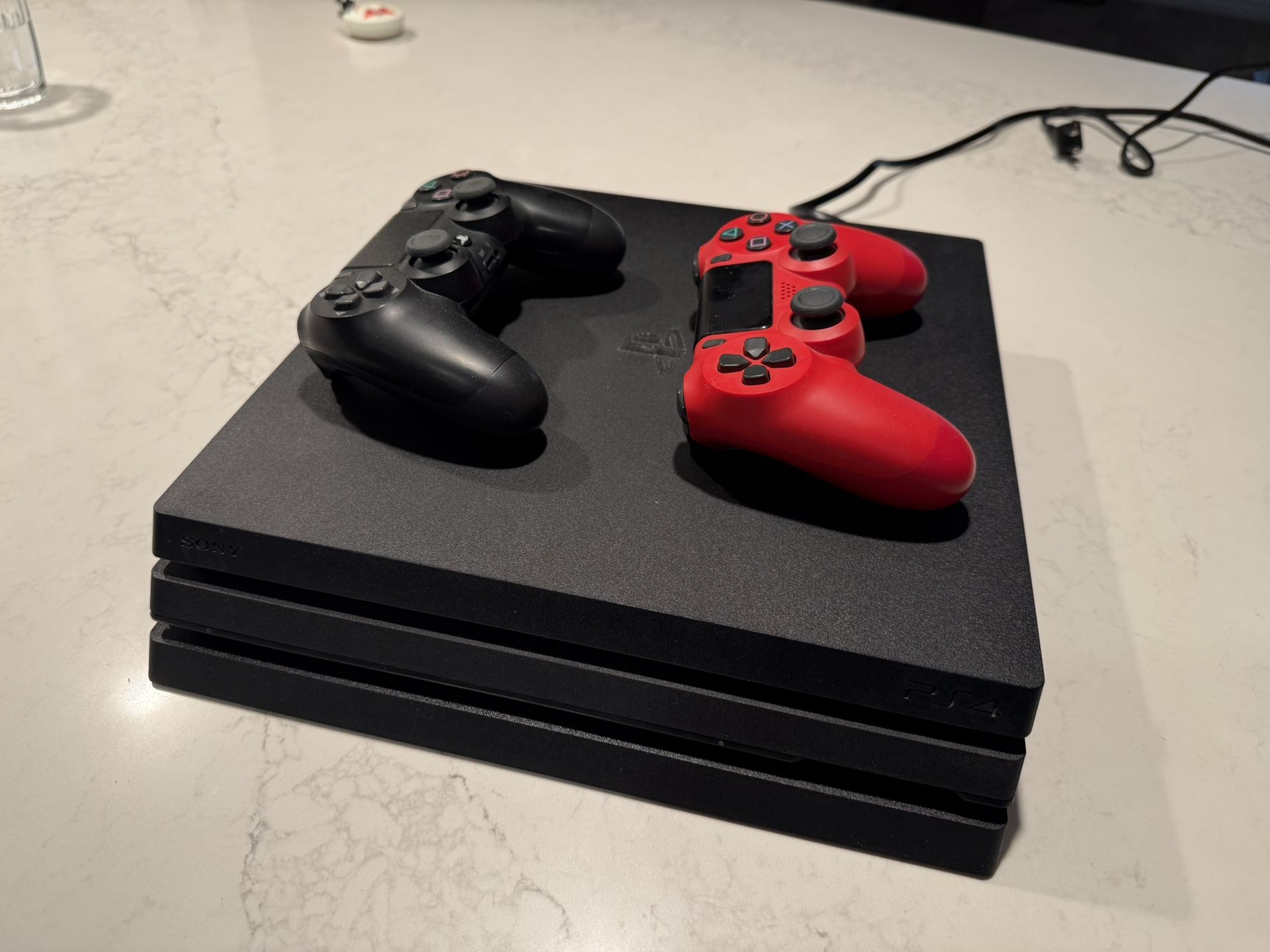 PS4 Pro & 2 DualShock Controllers