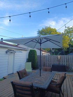 Sunrise..  Large rectangle, crank up light up umbrella with heavy duty steel center stand