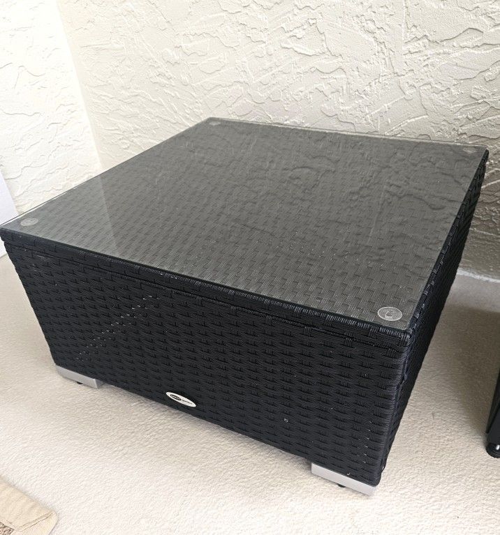 Outdoor black wicker coffee table with glass top