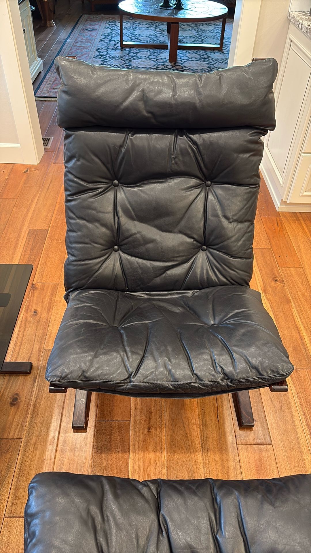 Leather Chair And Ottoman.