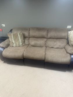 Micro fiber sofa . Well maintained and clean .. metal frame