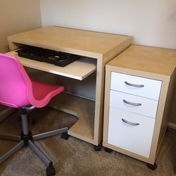 Office desk with side drawers and chair.