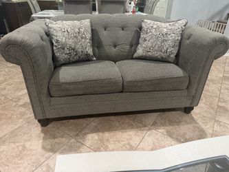 Gray Tufted Loveseat with Nailhead Trim