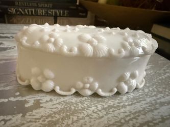 Beautiful Vintage Fostoria Milk Glass Floral Trinket Box 1950’s   Elegant milk glass trinket box is white with a raised floral and scroll pattern. Thi
