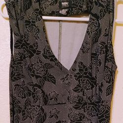 Ladies Medium Sleeveless Dress With Black Floral Designs 