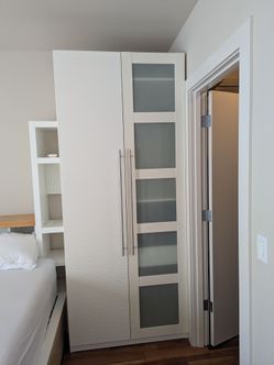 Two White Ikea Closet Units