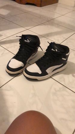 Black and white Puma High tops