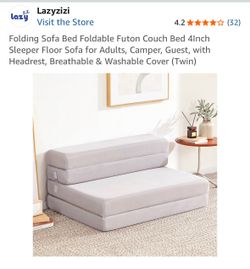 Folding sofa bed / futon