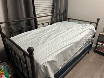 Daybed with trundle and two twin mattresses. One was only slept on a few times