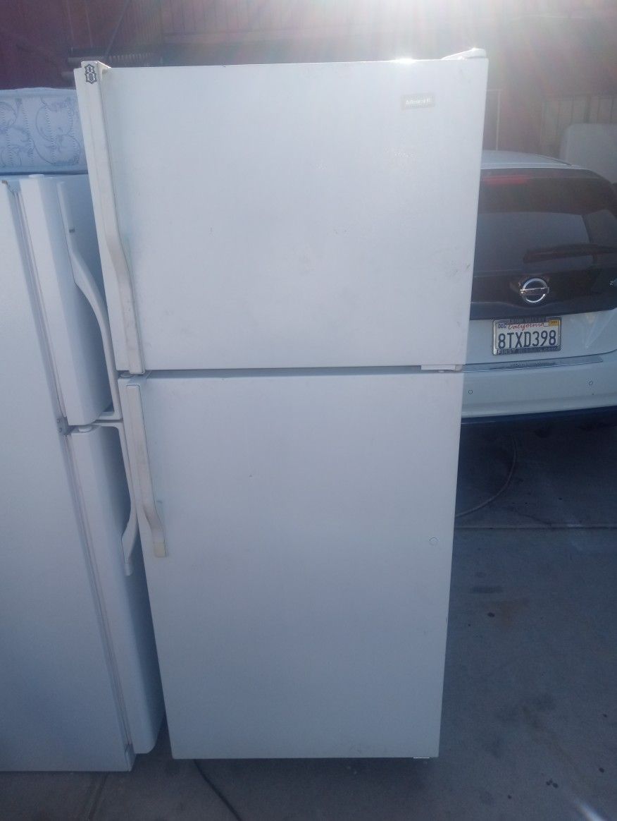 Working White Whirlpool Apartment-size Refrigerator