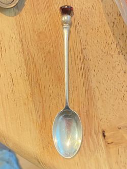 vintage William Johnson & Sons sterling silver Scottish thistle spoon with a red purple faceted stone.