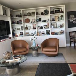 2 U-Turn Leather Swivel Chairs