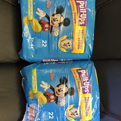 Two packages of Huggies Pullups