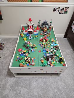 Multiple lego Mario expansion sets + table
