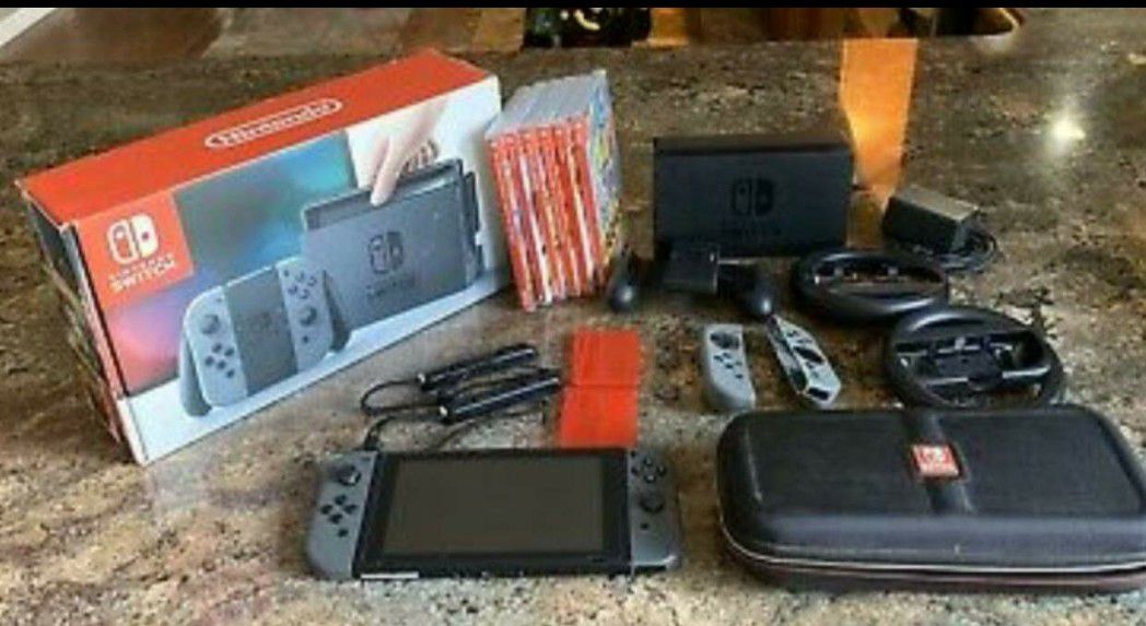Like new nintendo switch console w/ box and 6 games (more if interested)