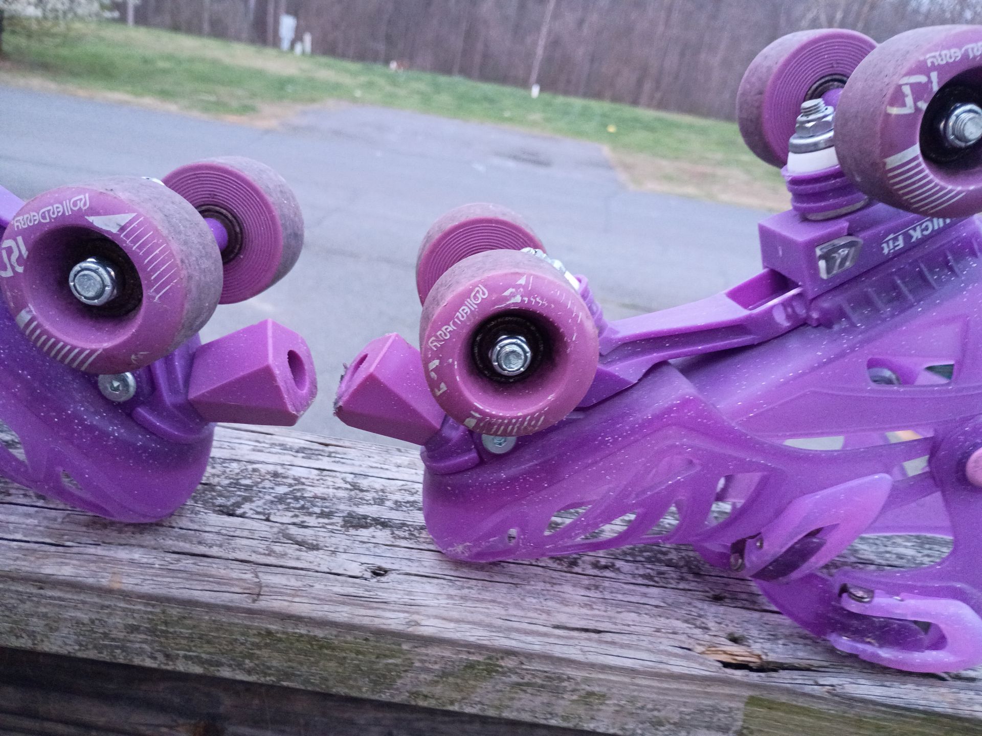 Set of pink, adjustable quad roller skates for children