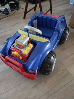 Toddler blue ride on activity car with steering wheel