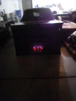Entertainment center with fireplace and heat control real heavy wood and 6 speaker's and 2 tweeters color brown and black