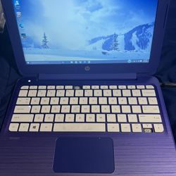 HP Purple Laptop With A Charger