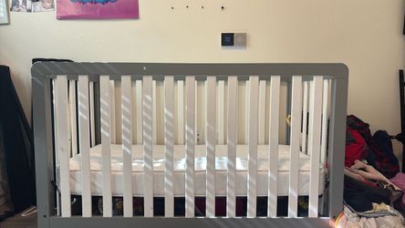 Grey and white crib
