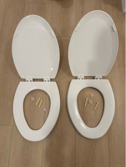 Elongated toilet lids