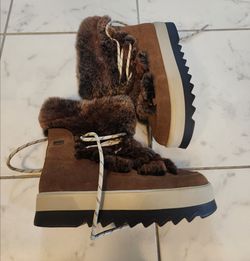 These are Cougar Vivian Limited Edition Genuine Rabbit Fur Boots, featuring a distinctive waterproof suede upper and chunky sole.