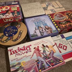 Board Games Lot Twister Moves Wizard of Oz Trivia Board Game Disney Trivia Collectors Tin Uno Deluxe Monopoly 2000 Collectors Tin Jurassic Park SNAFU