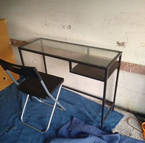 Small desk with glass top and chair