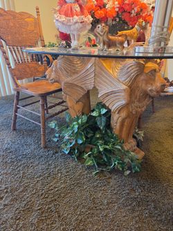 Lion table carved out of one piece of wood three lion heads 4 chairs glass top  one of a kind
