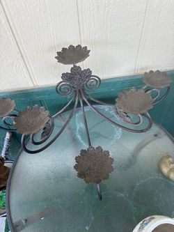 Decorative metal candle holder holds six candles
