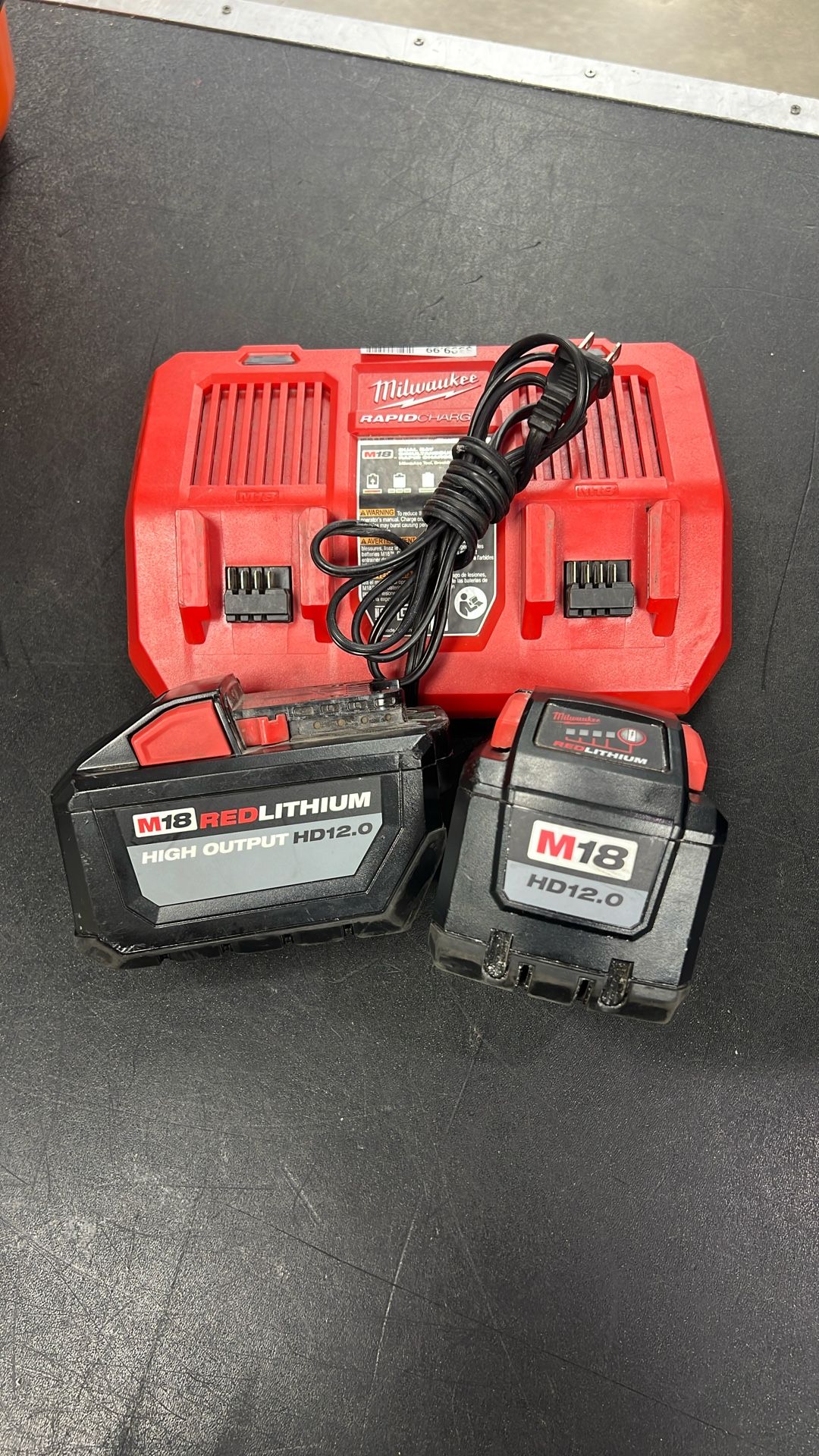 Milwaukee Rapid Charger And Two Batteries