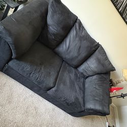 All black sofa and love seat set