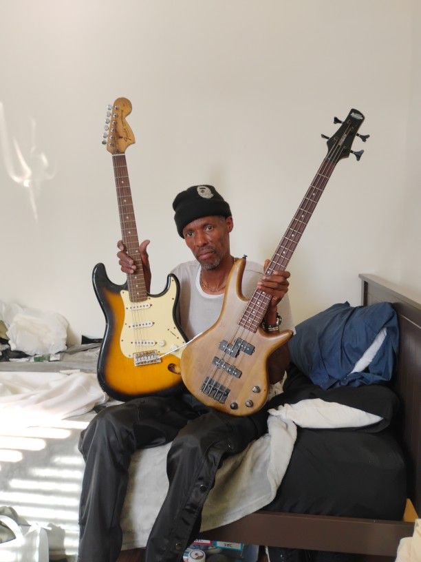 Fender Strat And Ibanez Bass Guitars
