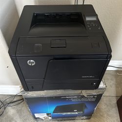2 HP LaserJet Pro 400 M401n in original packaging.