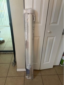 Tall white mesh gate