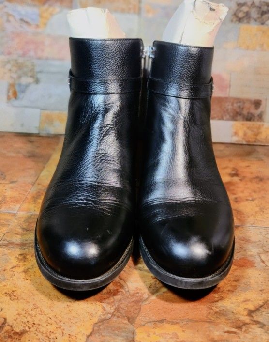 Michael Kors Finley Booties • Black Flat Ankle Boots • Silver Accents • Featuring A Round Toe • Studed Details & Logoed Zipper Closure • Low Heel • 