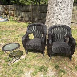 Two black wicker chairs