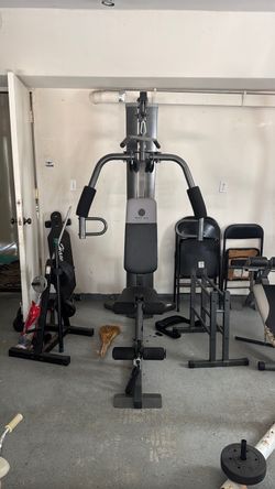 Bench press machine, lay pull downs, leg extension and bicep machine all in one machine.