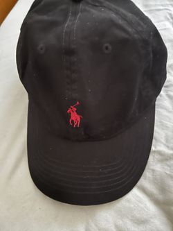 Black polo hat w/ red logo