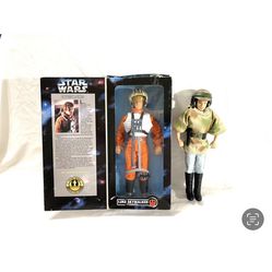 Great condition 1979 issue princess Leia and in the box Star Wars 1996 issue Luke Skywalker