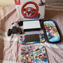 Super Mario Nintendo Switch V2 128GB custom with 2 $65 brand New Games & Racing Mario Wheel with pedels, all you see for $320 firm combo. Less $$$ les