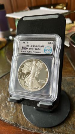 1987 – S silver eagle .999 ICG PR70! DCAM UNC OLDER DATE WOW! SIGNED AUSTIN HUTTO PRESIDENT ICG!