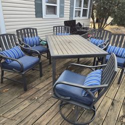 7-Piece Outdoor Patio Dining Set w/ Cushions, Rockers & Storage — $300