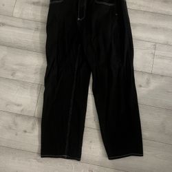 baggy EMPYRE pants embroided with white stitching  