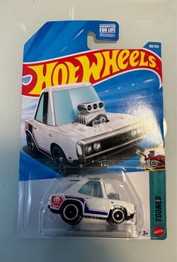 New Hot Wheels Tooned '70 Dodge Charger die-cast car. This white plastic and metal vehicle is part of the Tooned series and is in its original blister